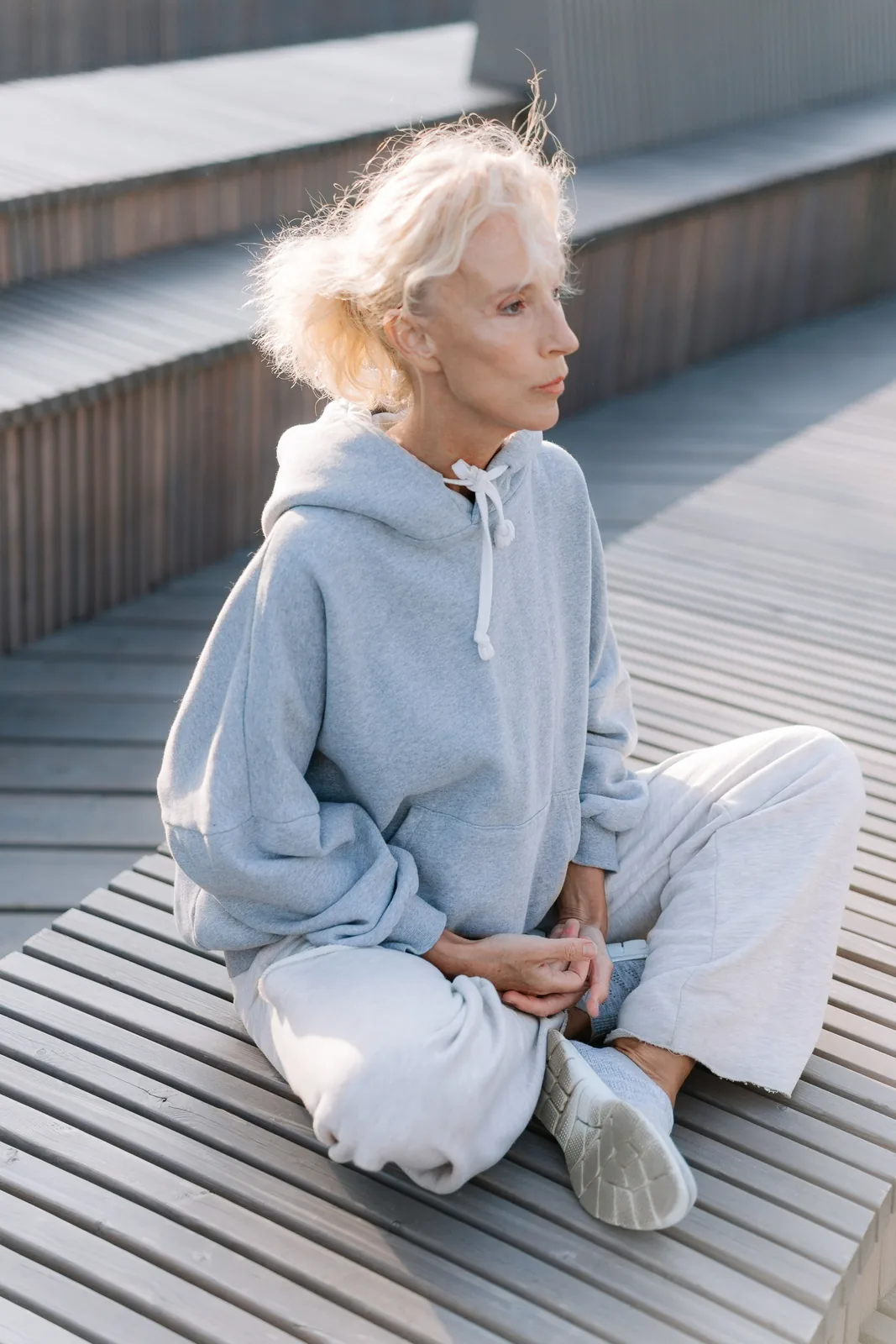 A woman sitting quietly outdoors in the morning